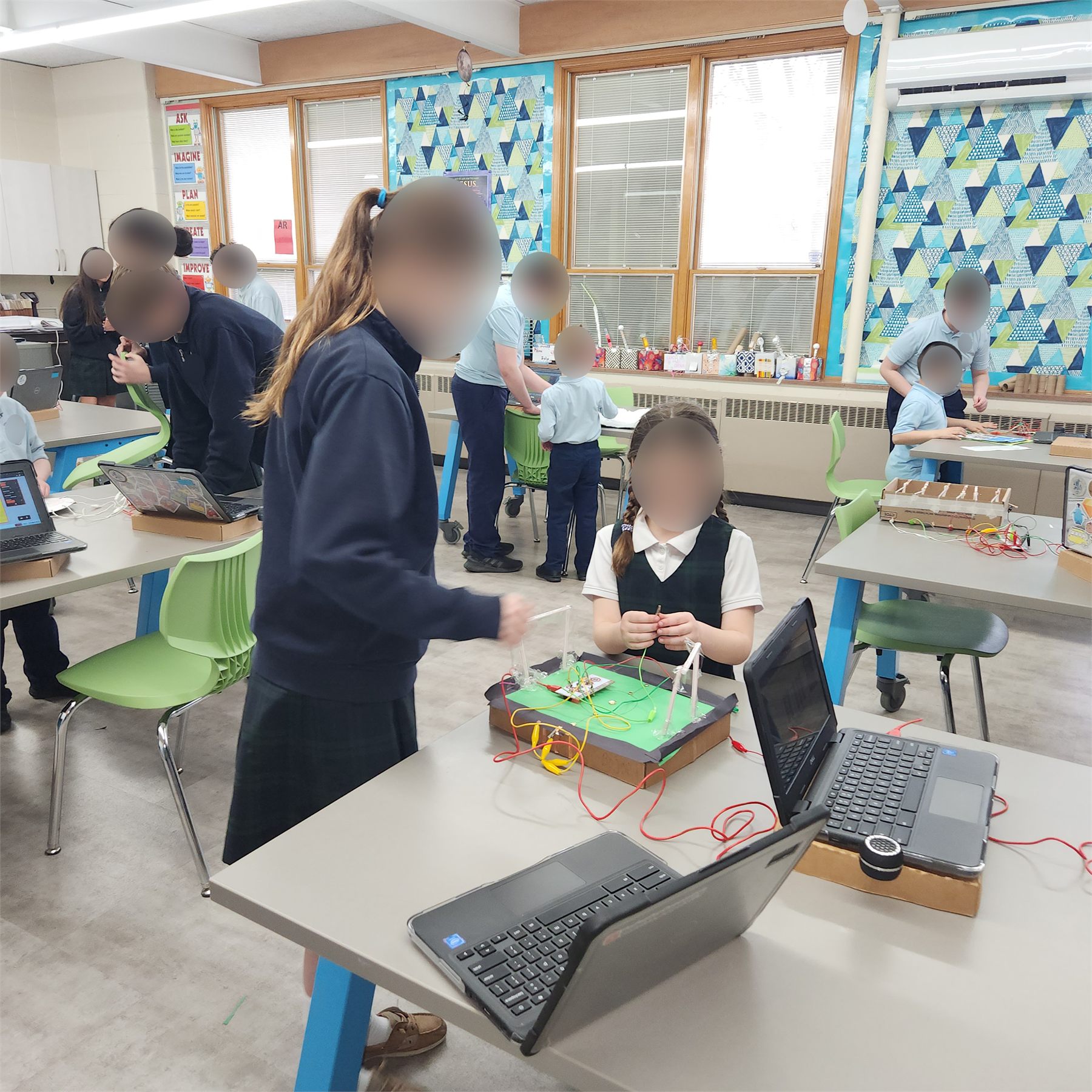 Students sharing instrument projects in the makerspace