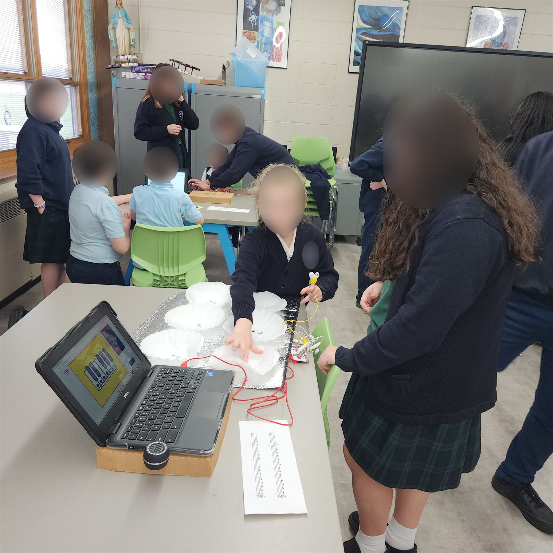 Students testing a Makey Makey instrument